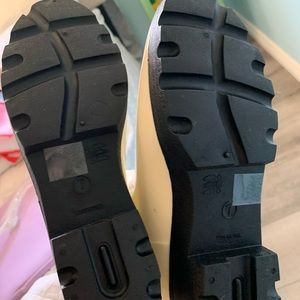 White and black combat rain boots